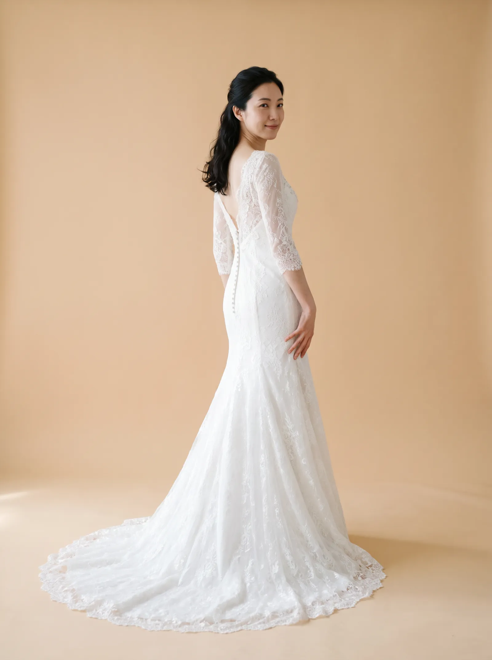 Josephine wedding gown, back full-length, over-shoulder glance