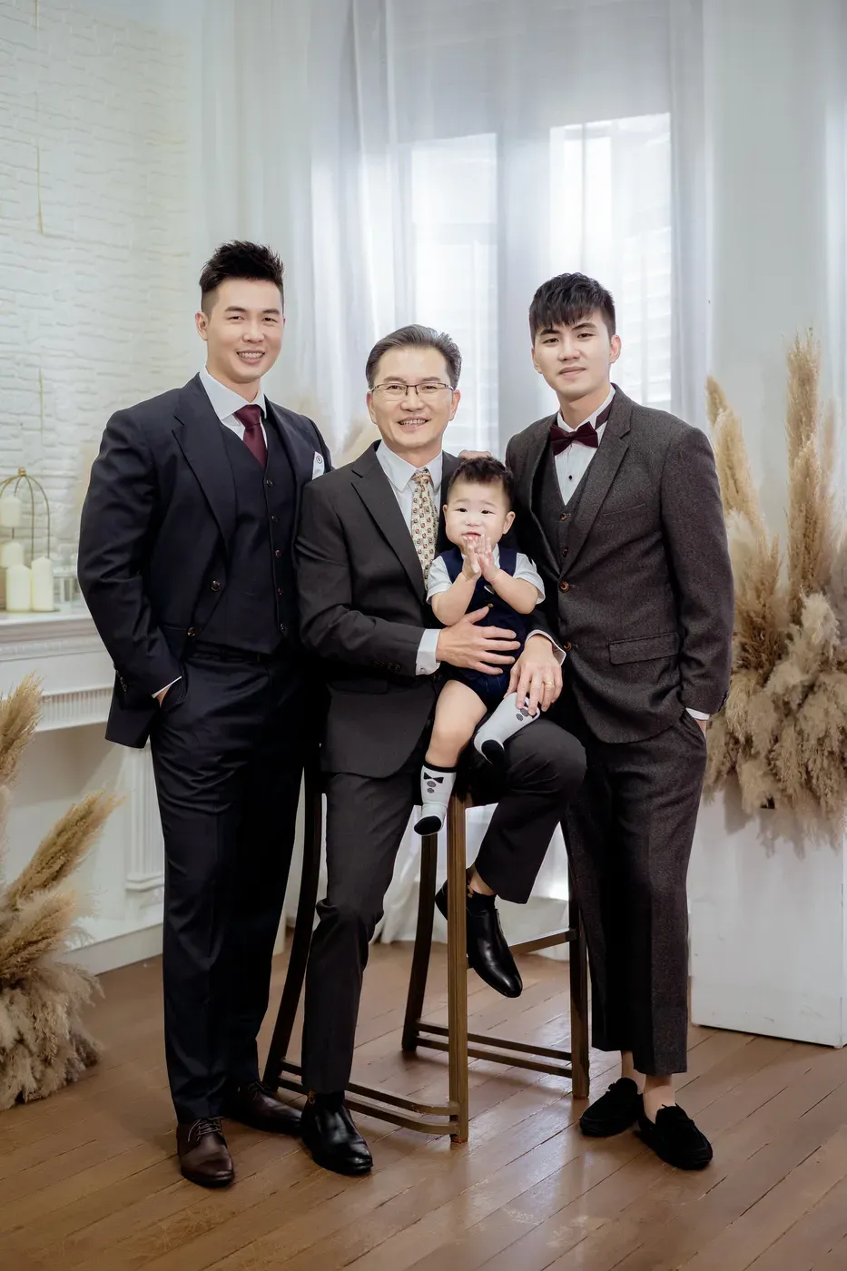 Formal family portrait in gowns and suits - family photo studio Singapore