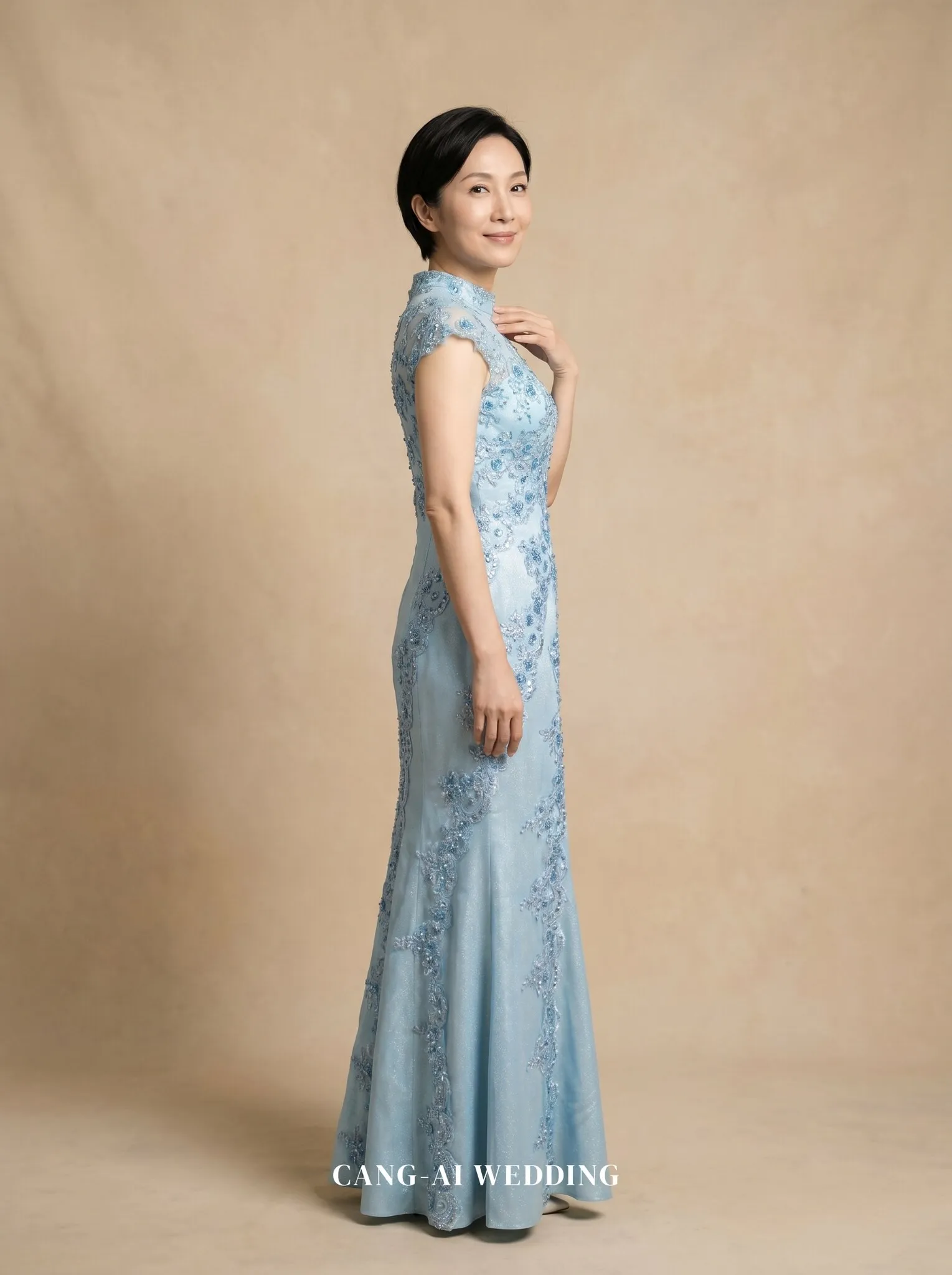 mother_gown_70 - Statuesque profile with hand at collarbone