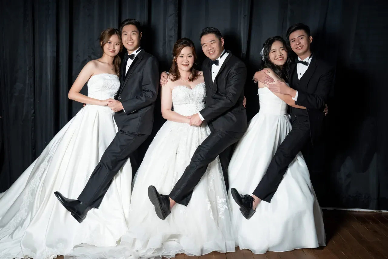 Formal family portrait in gowns and suits - family photo studio Singapore