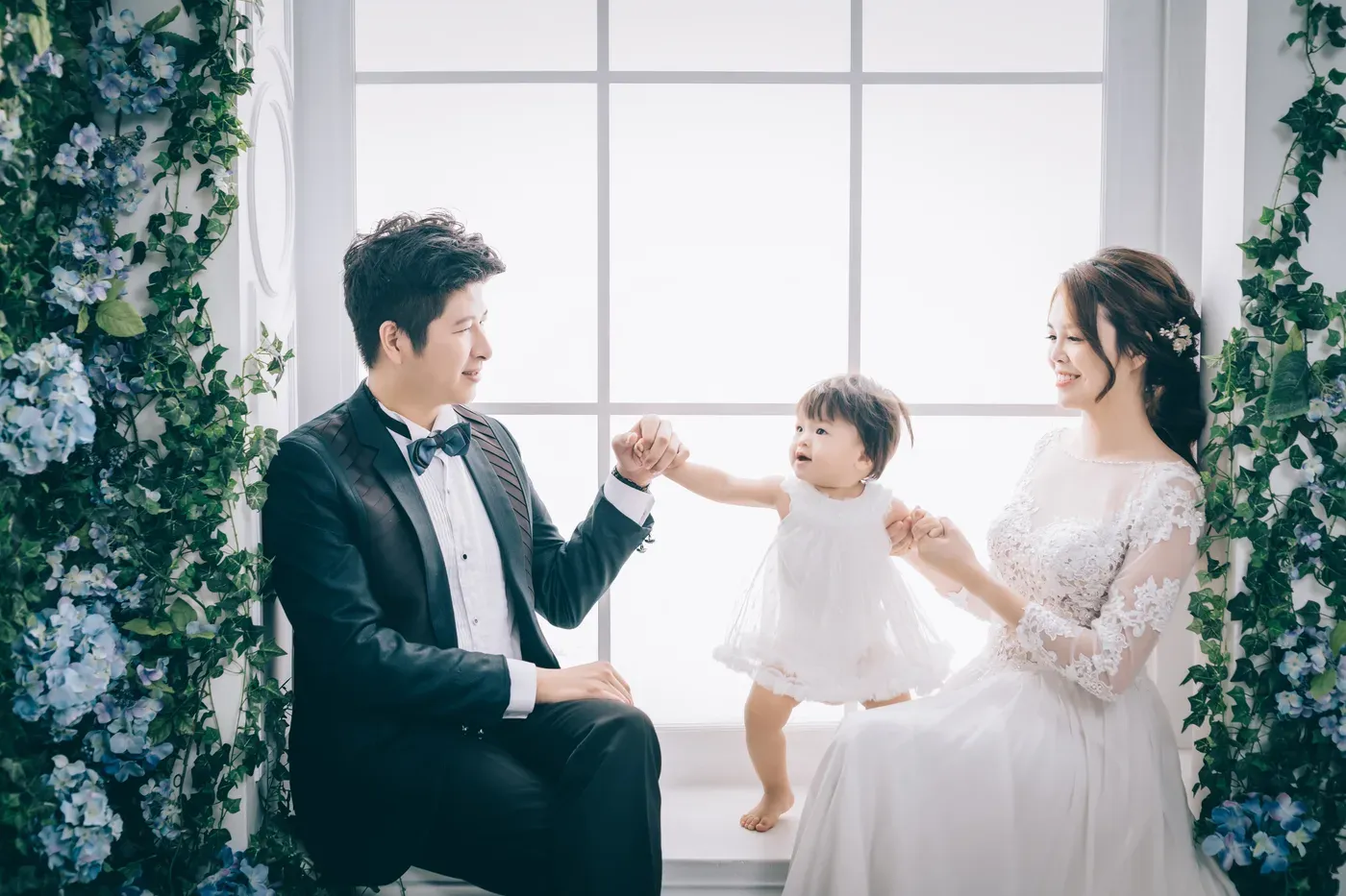 Formal family portrait in gowns and suits - family photo studio Singapore