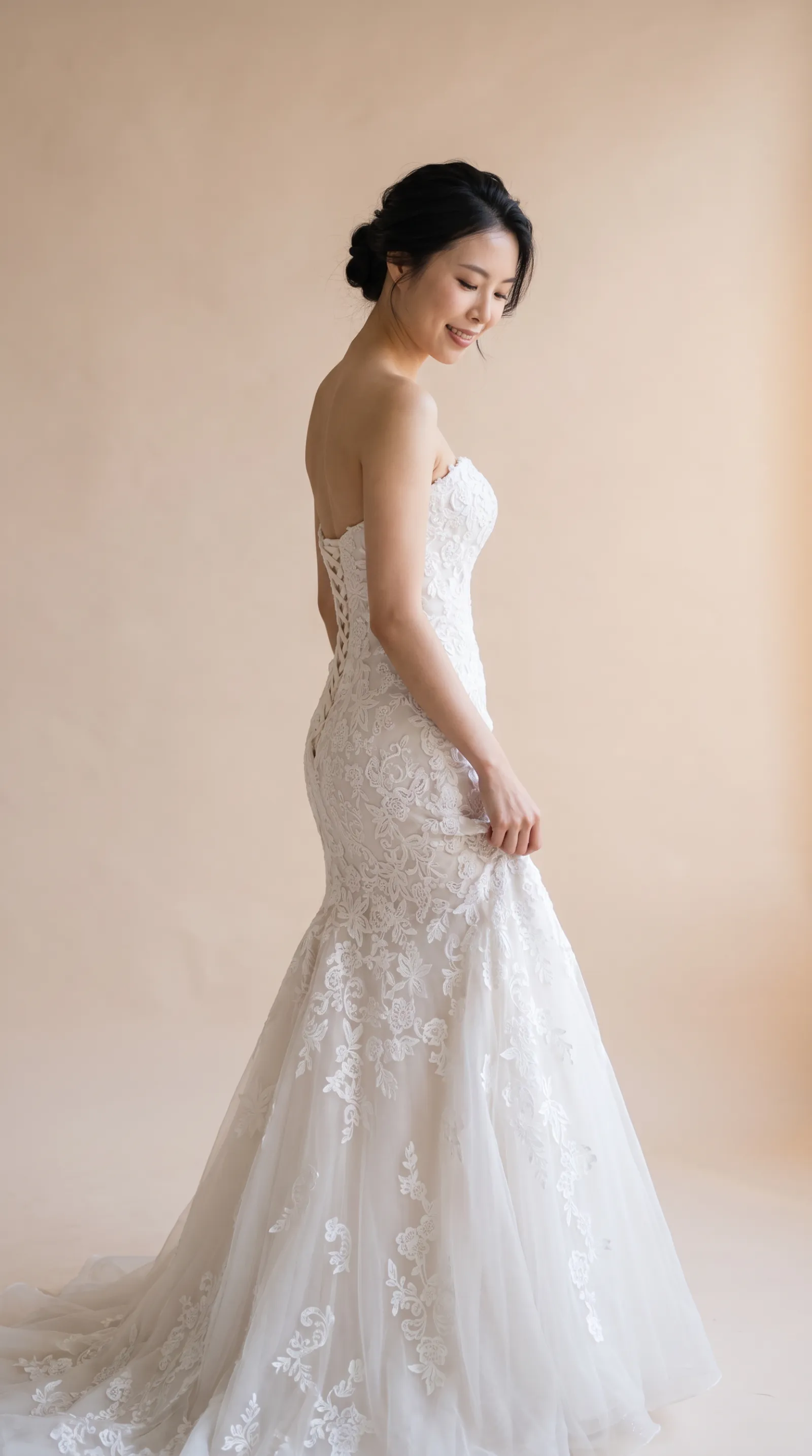 Isabella — Gently adjusting the gown's side fabric