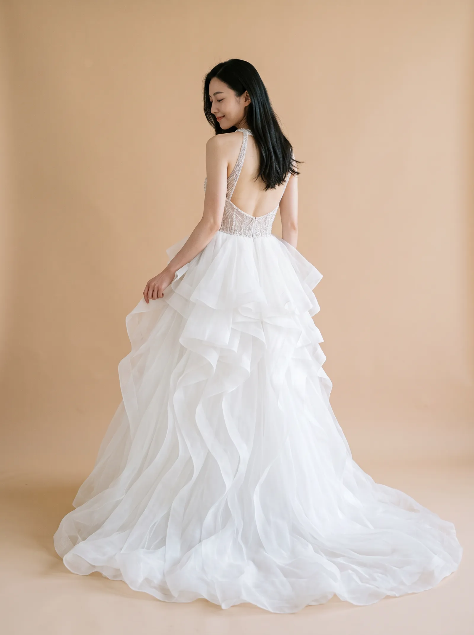 Seraphine wedding gown, back - over-shoulder gaze lowered