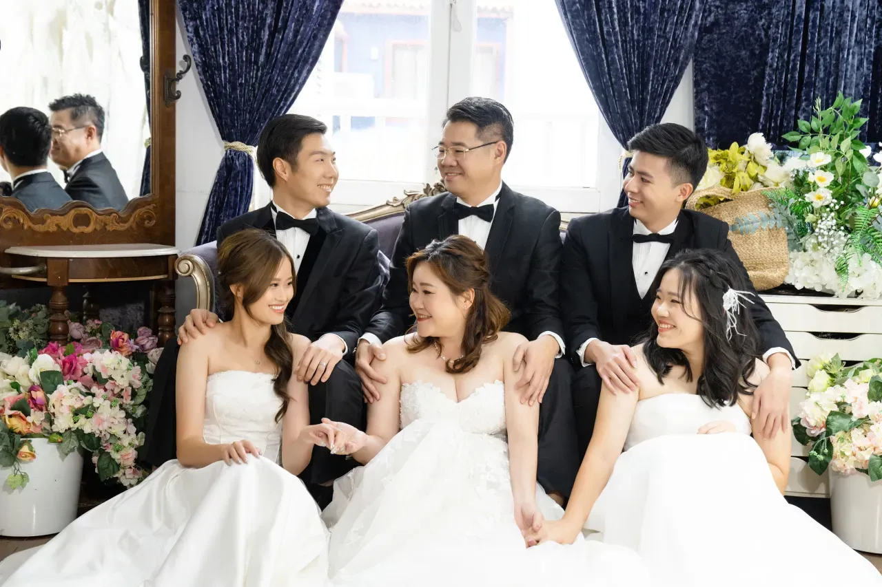 Formal family portrait in gowns and suits - family photo studio Singapore
