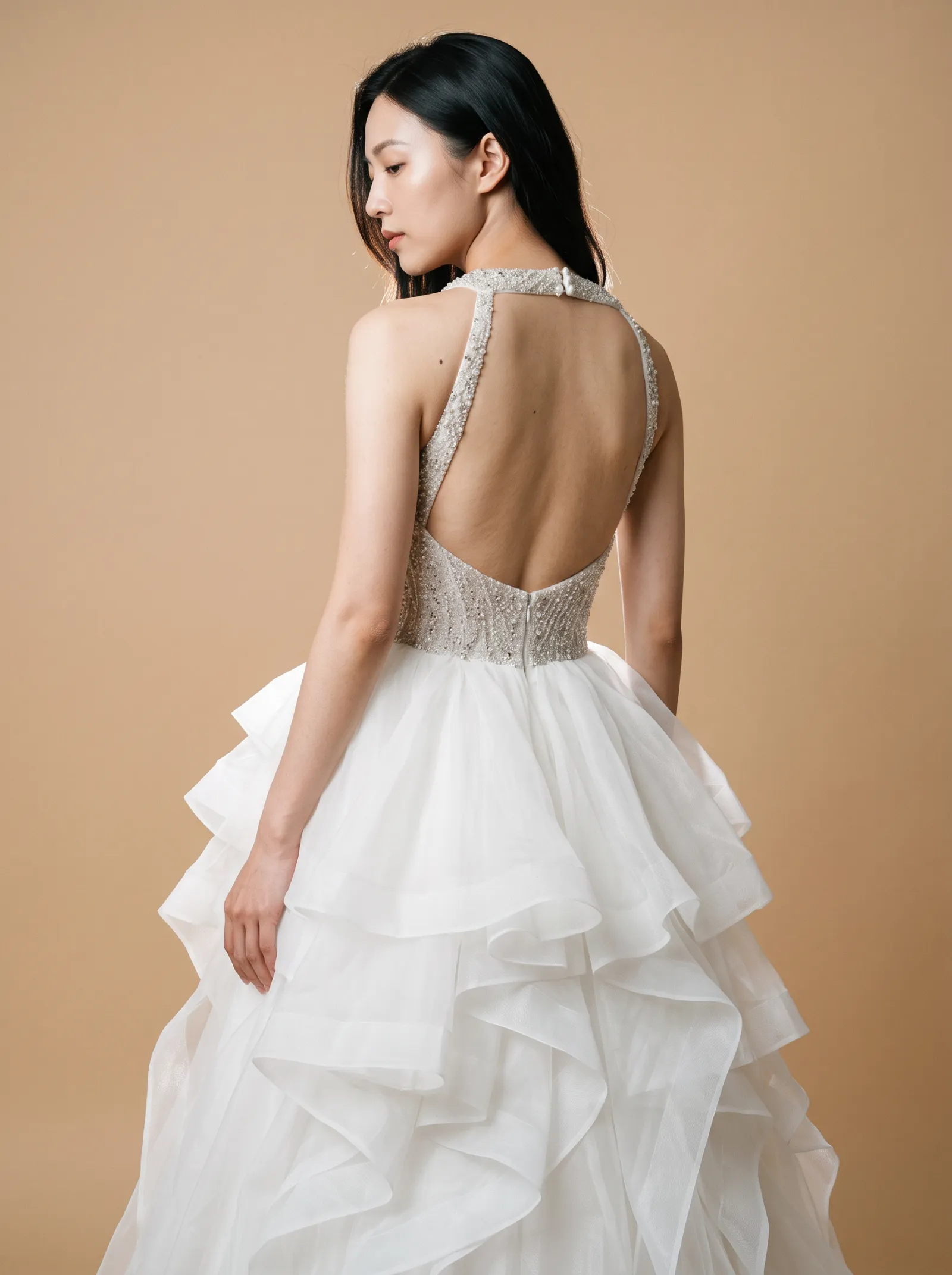 Seraphine wedding gown, three-quarter close - back, glancing over the shoulder