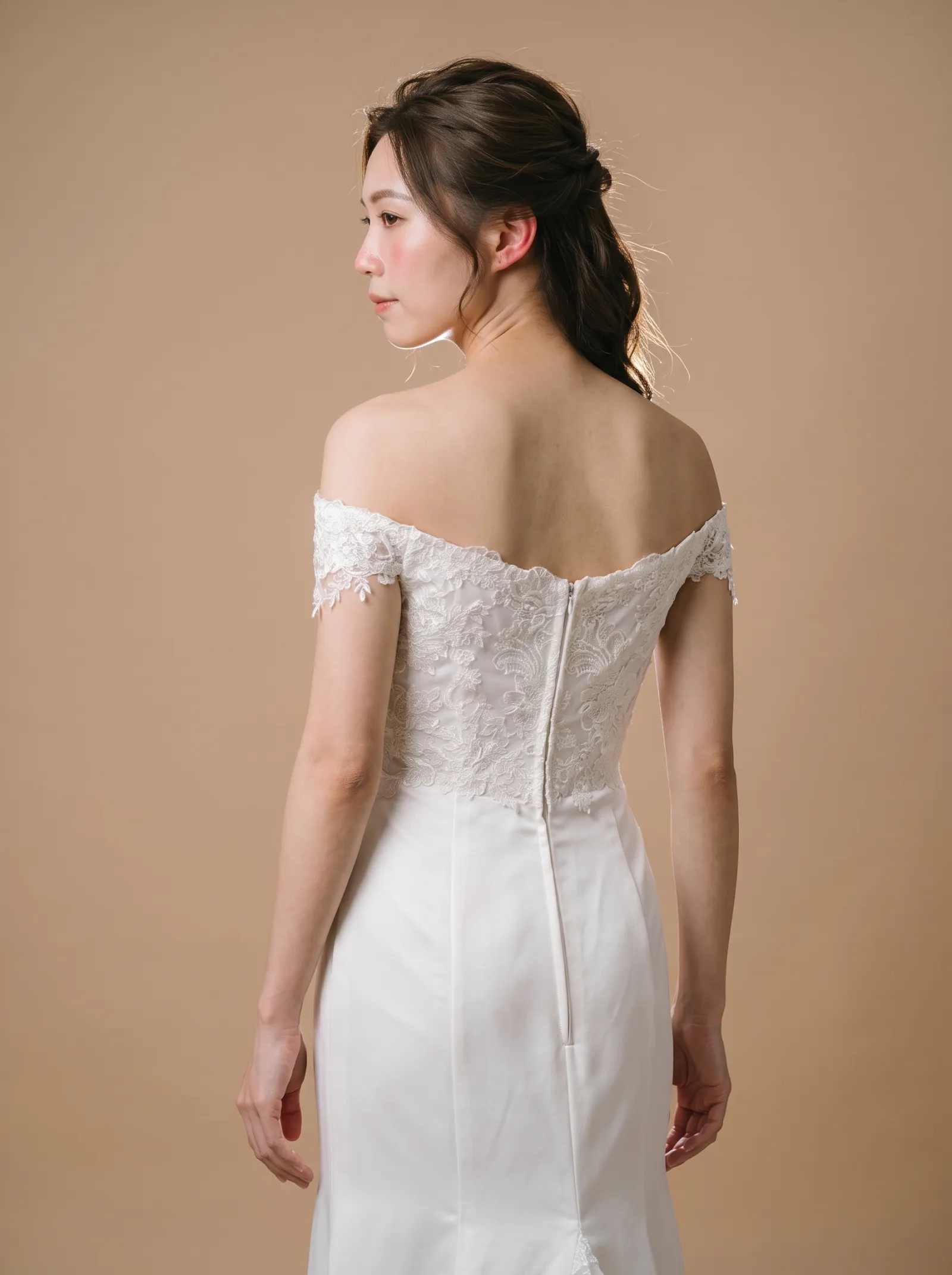 Genevieve wedding gown, three-quarter close - back, glancing over the shoulder