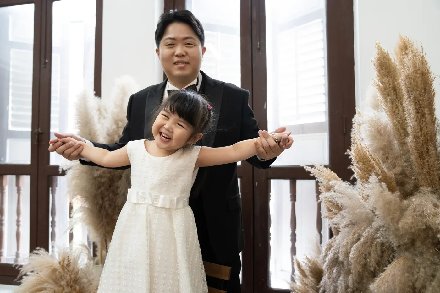Formal family portrait in gowns and suits - family photo studio Singapore