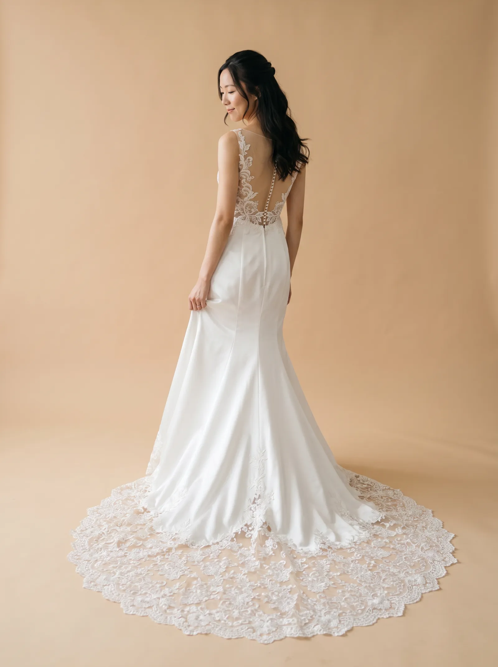 Eliana wedding gown, back - over-shoulder gaze lowered