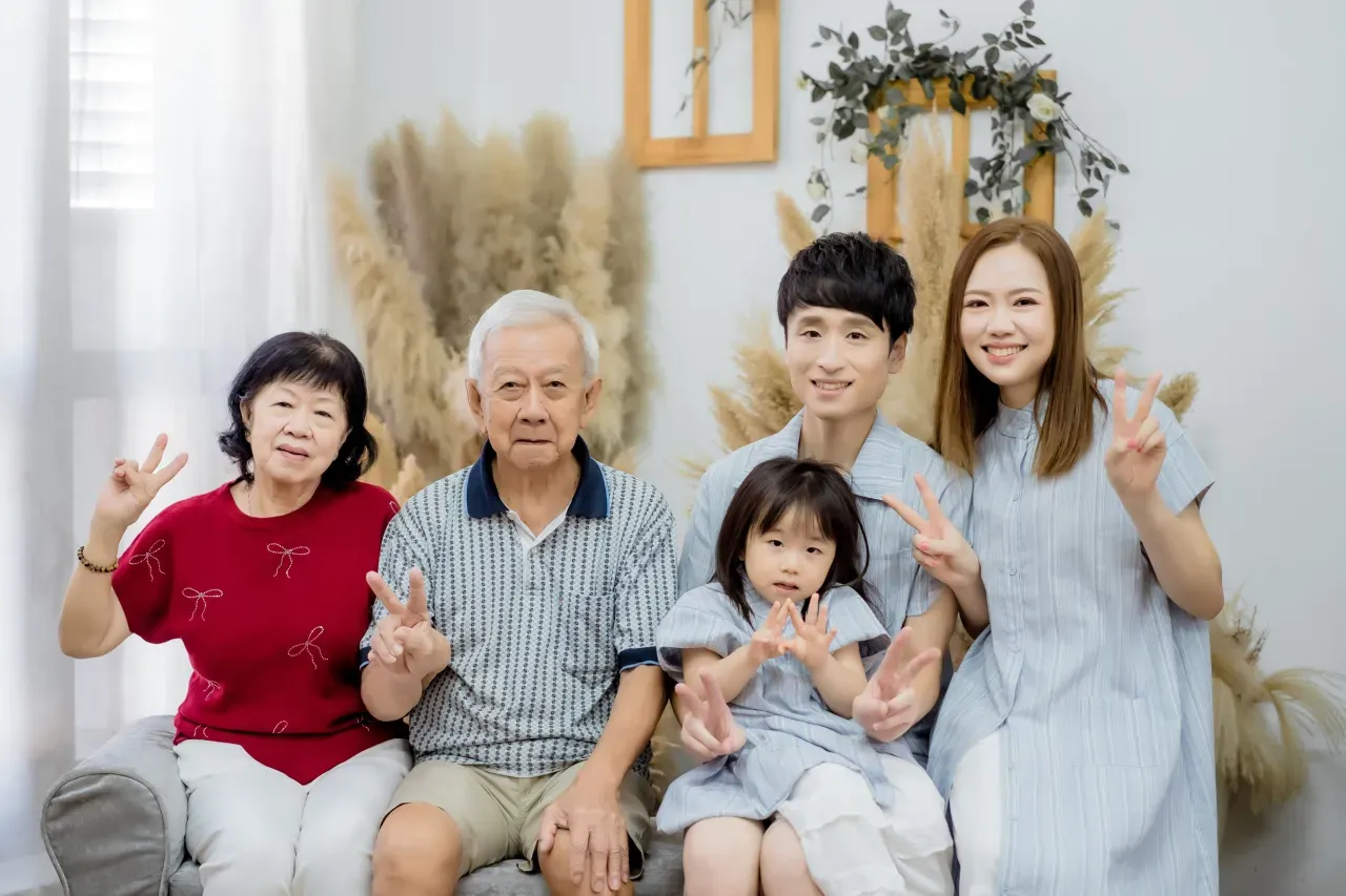 Three generation family photoshoot Singapore - grandparents, parents and children photographed together