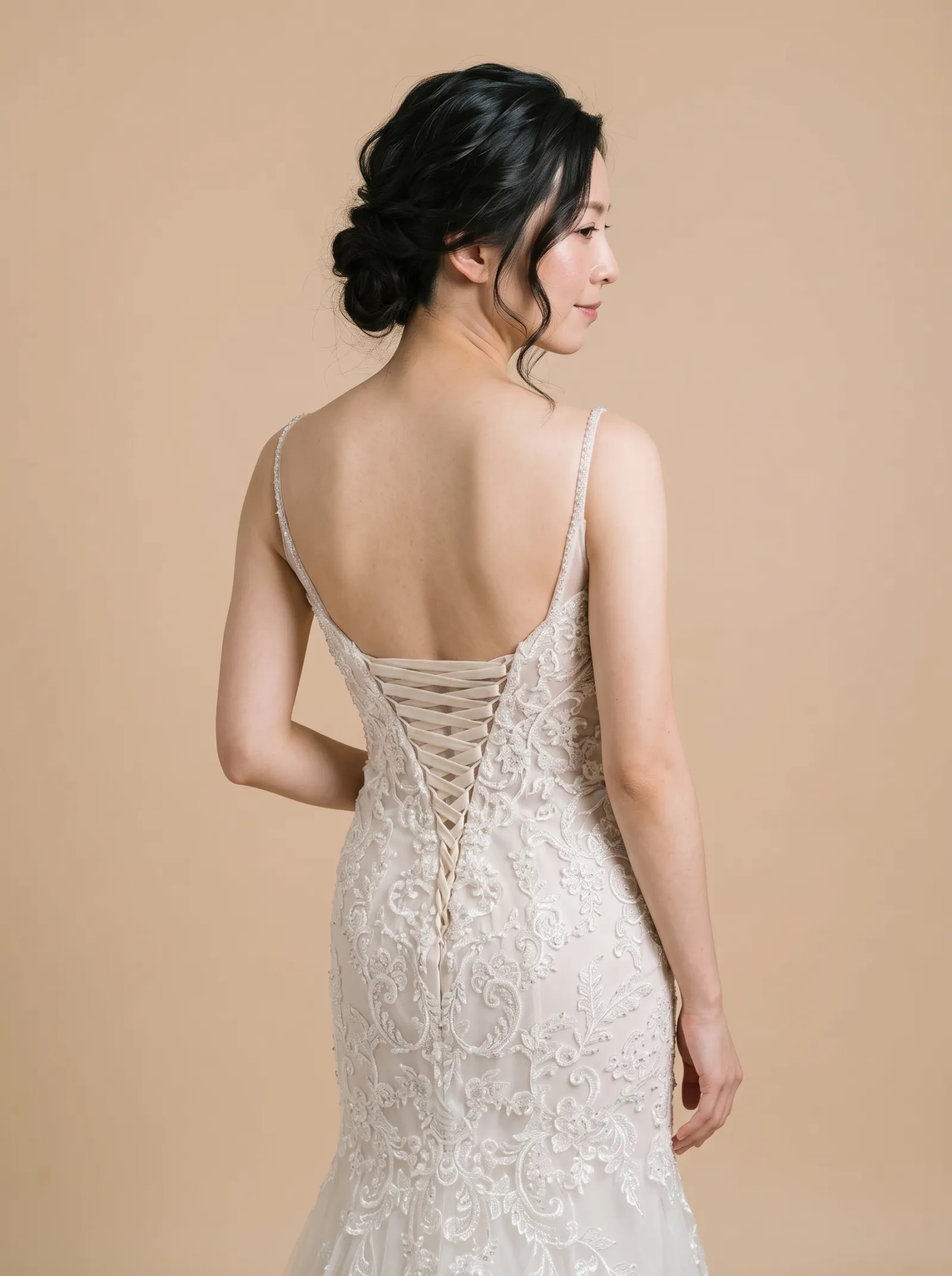 Ravenna wedding gown, three-quarter close - back, glancing over the shoulder