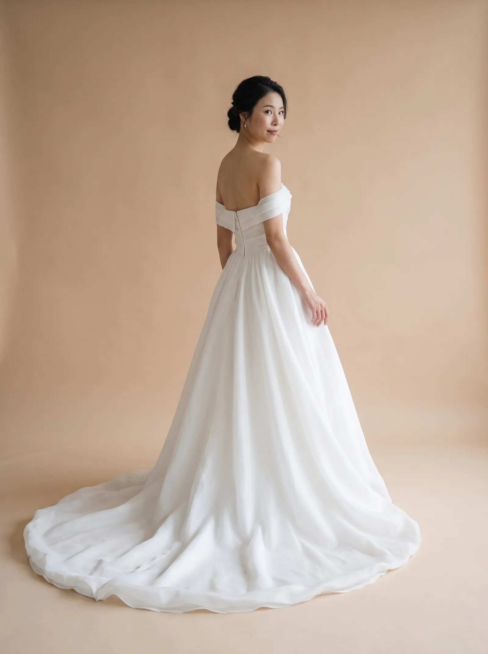 Romy wedding gown, back full-length, over-shoulder glance