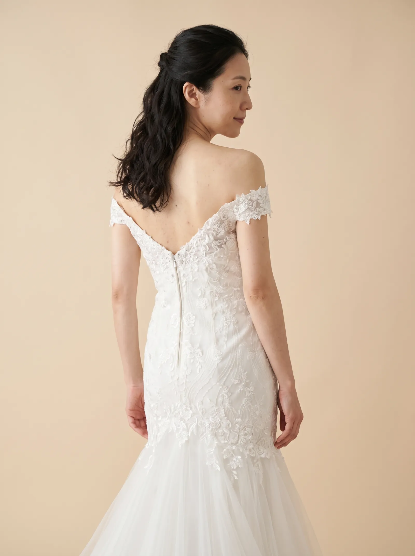 Ondine wedding gown, close back view glancing over the shoulder