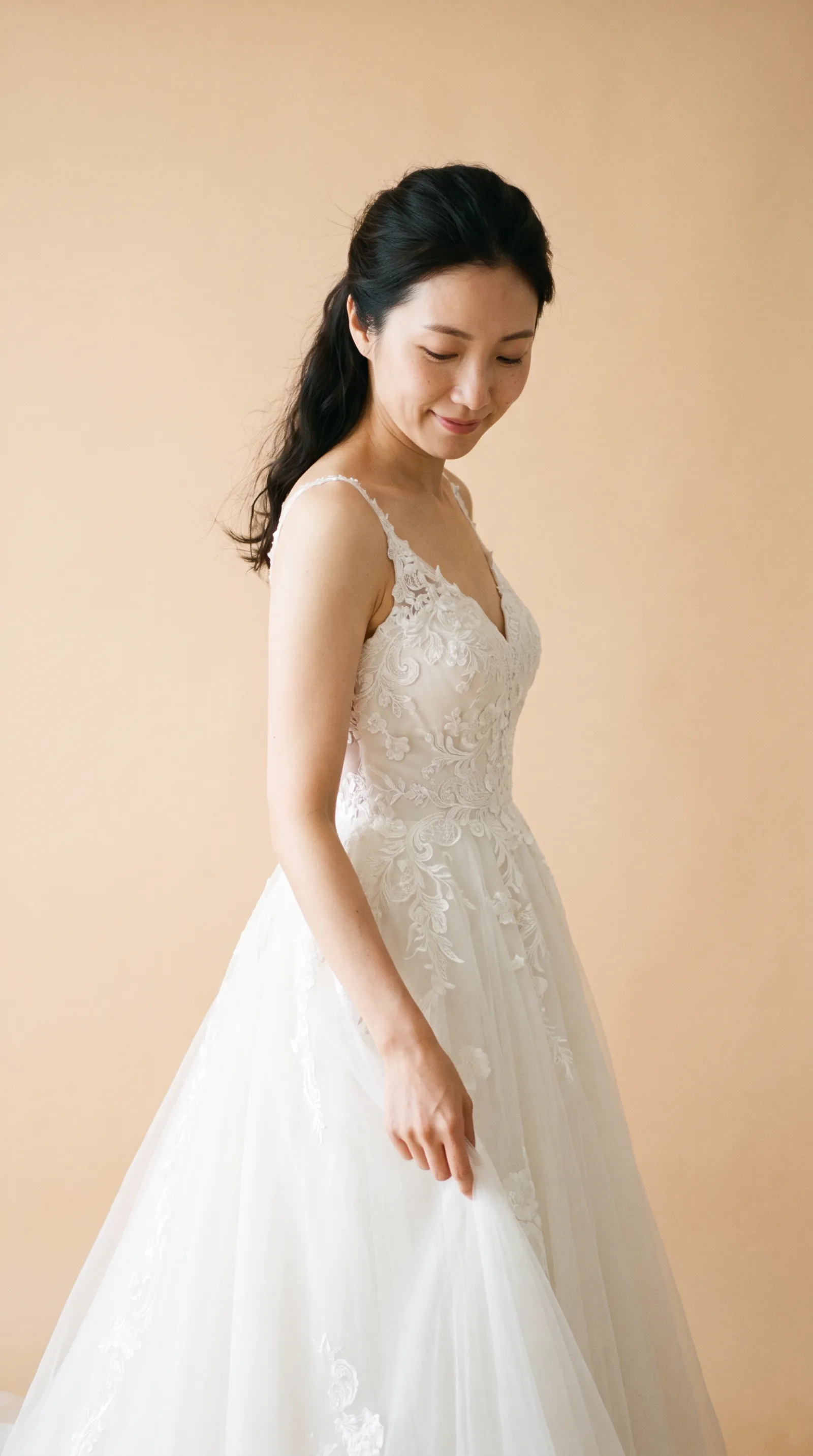 Juniper — Gently adjusting the gown's side fabric