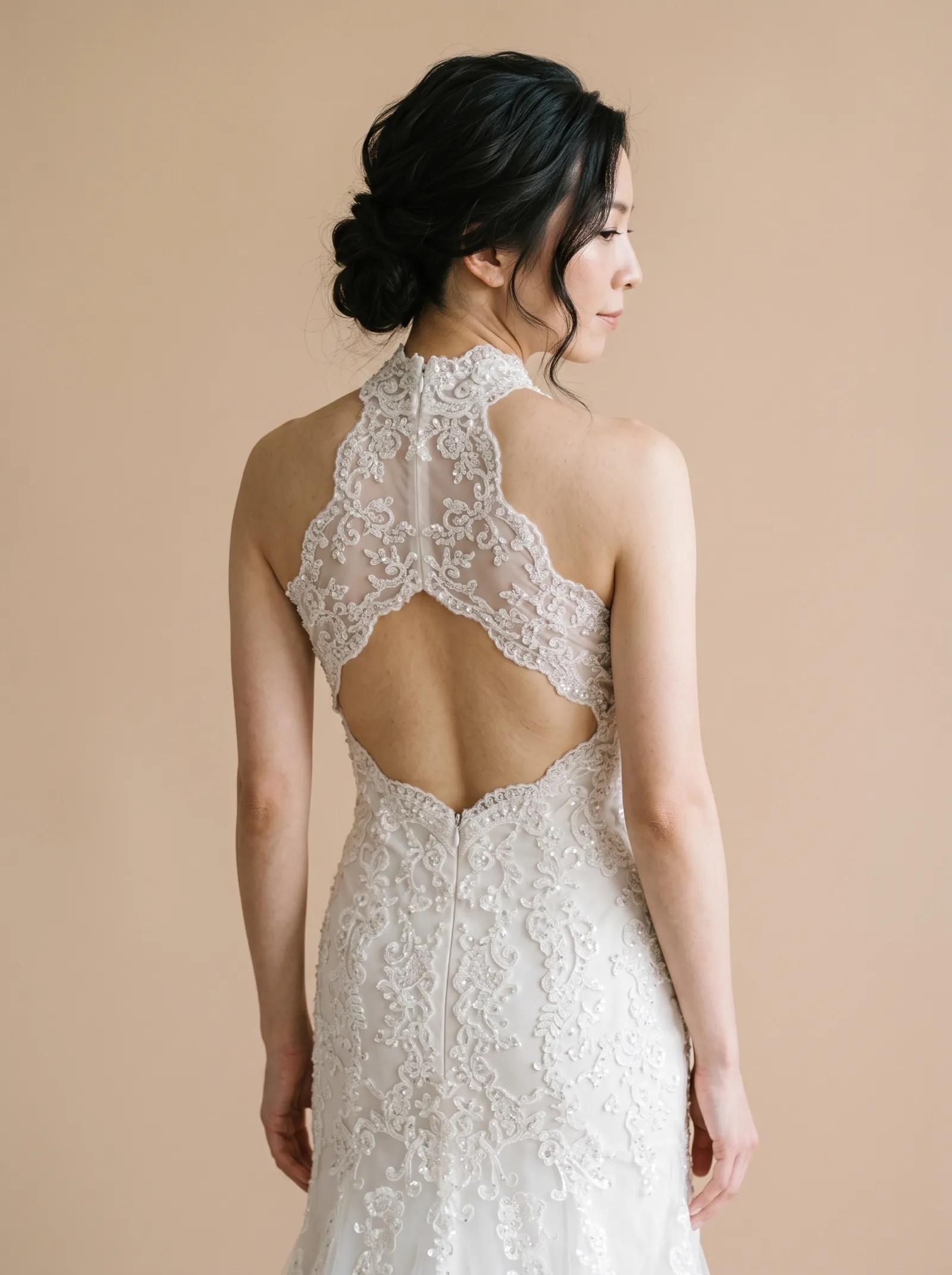 Regina wedding gown, three-quarter close - back, glancing over the shoulder