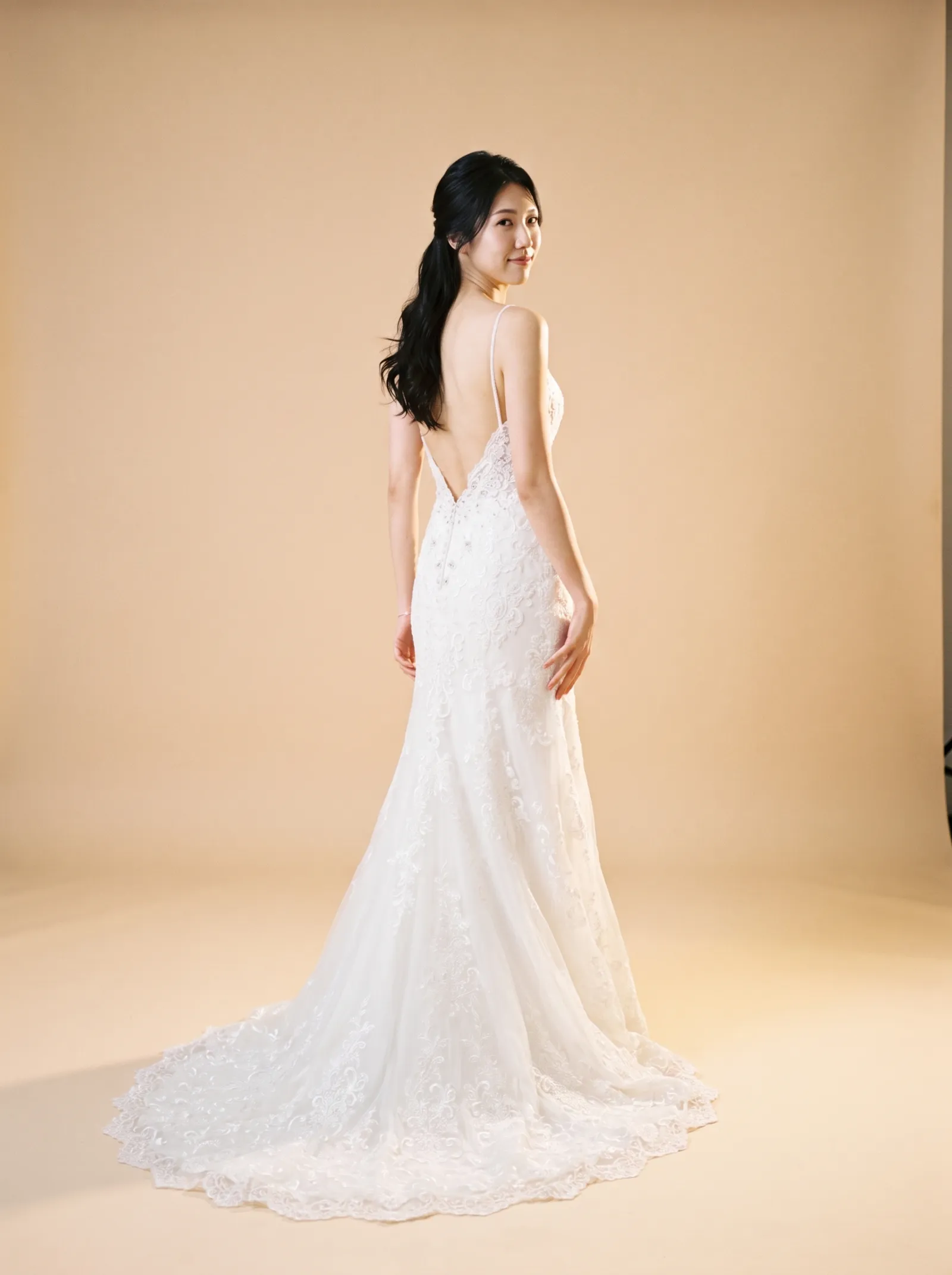 Cleo — Standard Catalog · Back full-length, over-shoulder glance