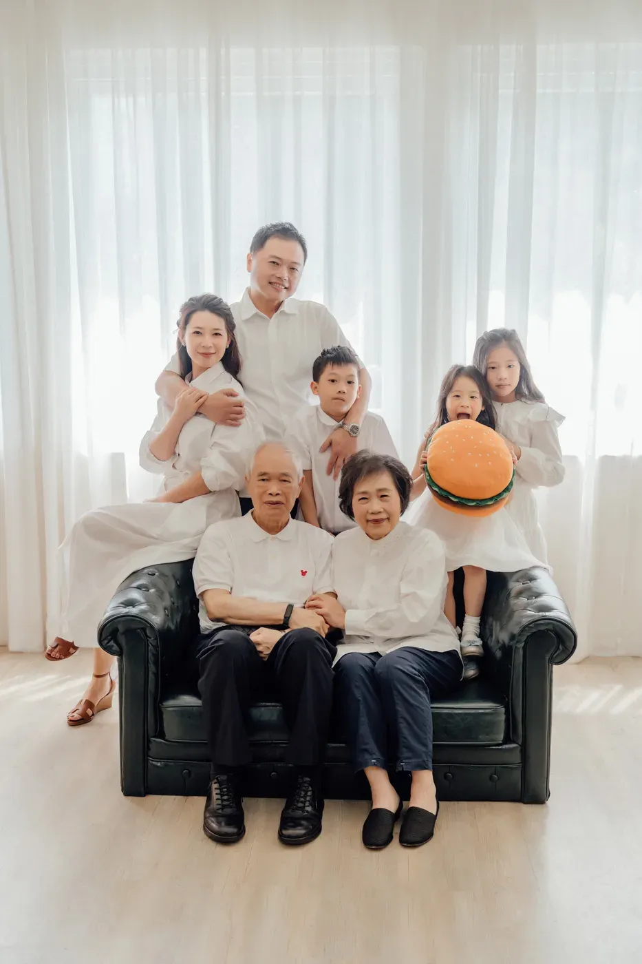 Three generation family photoshoot Singapore - grandparents, parents and children photographed together