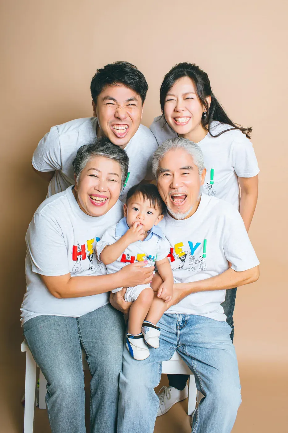 Three generation family photoshoot Singapore - grandparents, parents and children photographed together