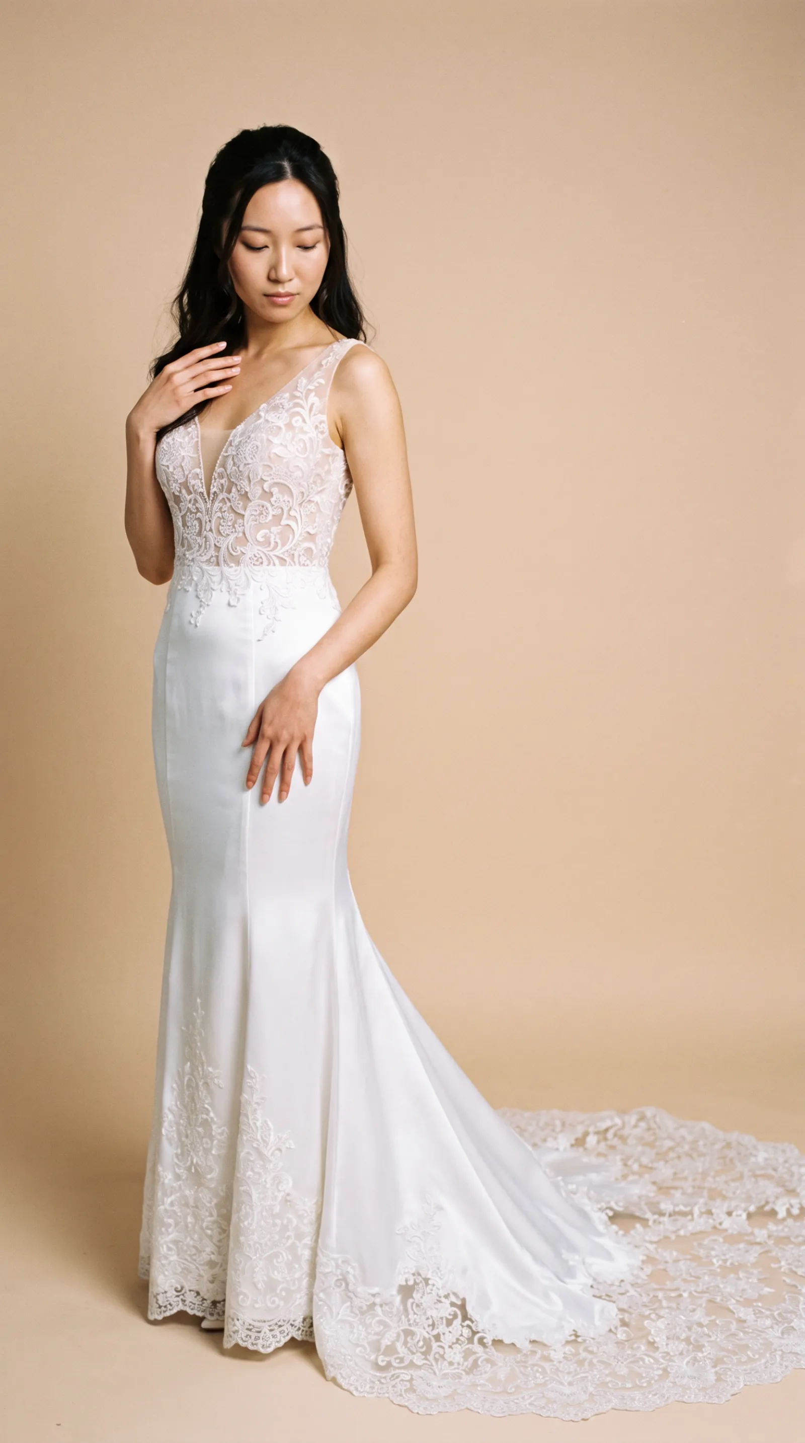 Eliana — Resting hand softly on the gown