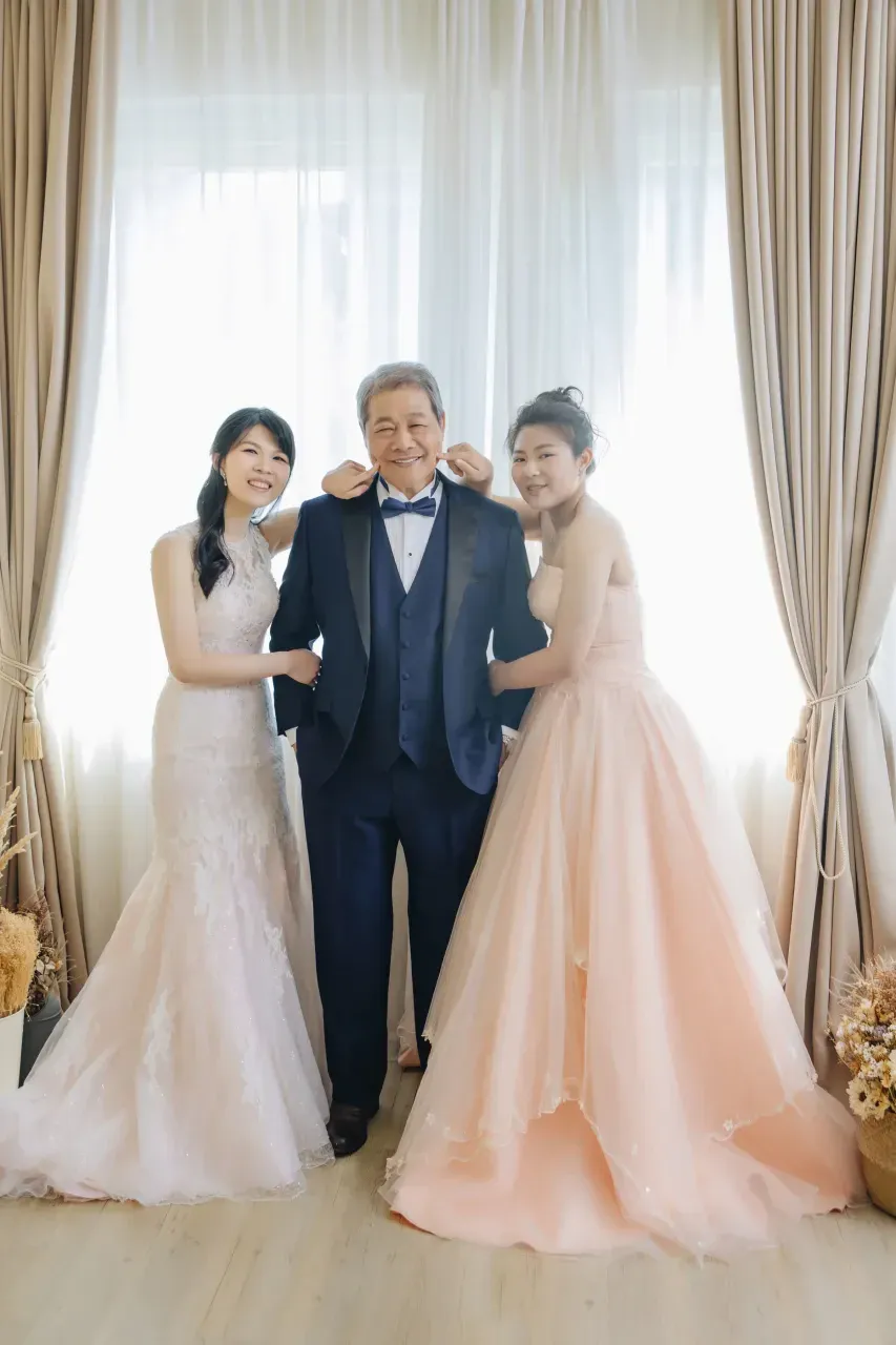 Formal family portrait in gowns and suits - family photo studio Singapore