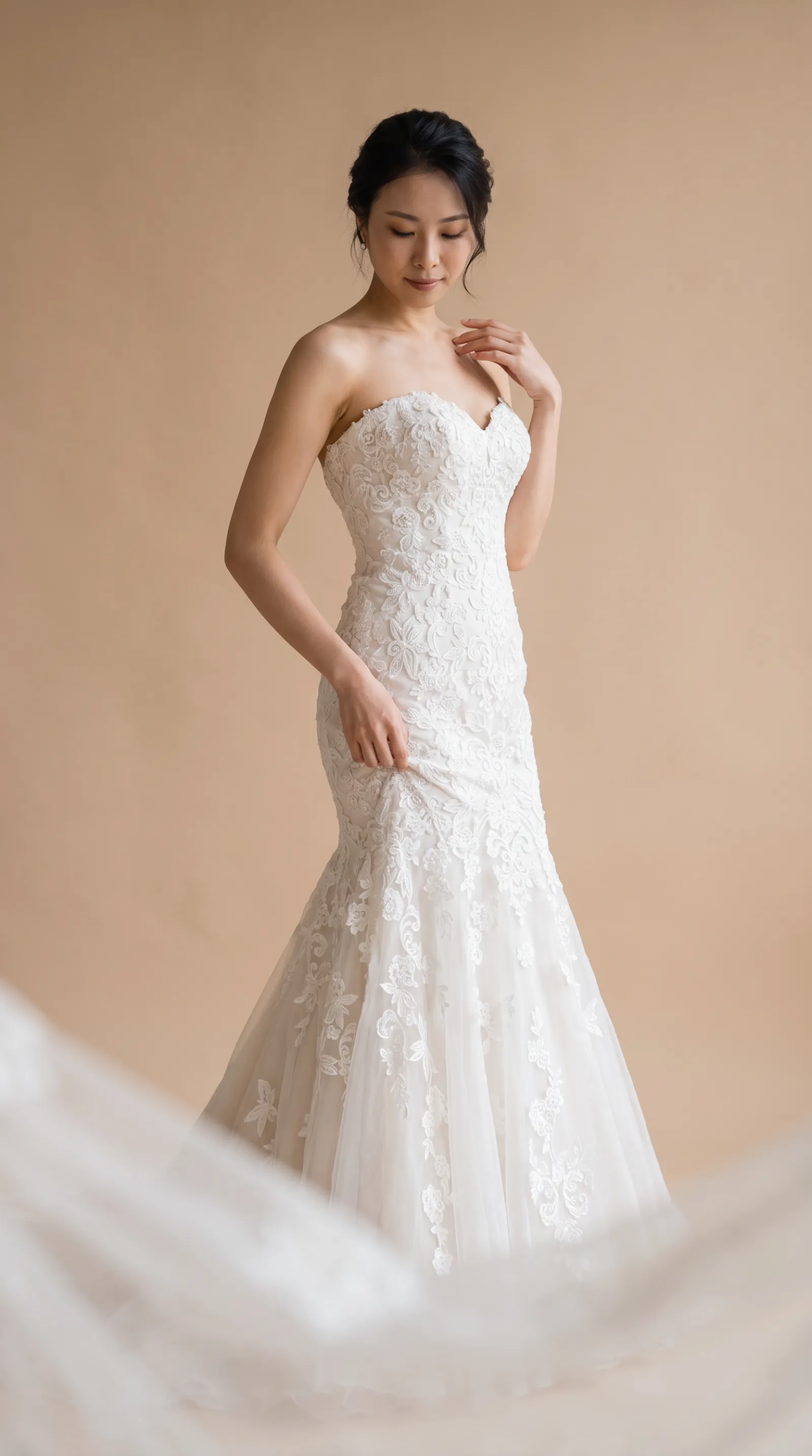 Isabella — Resting hand softly on the gown