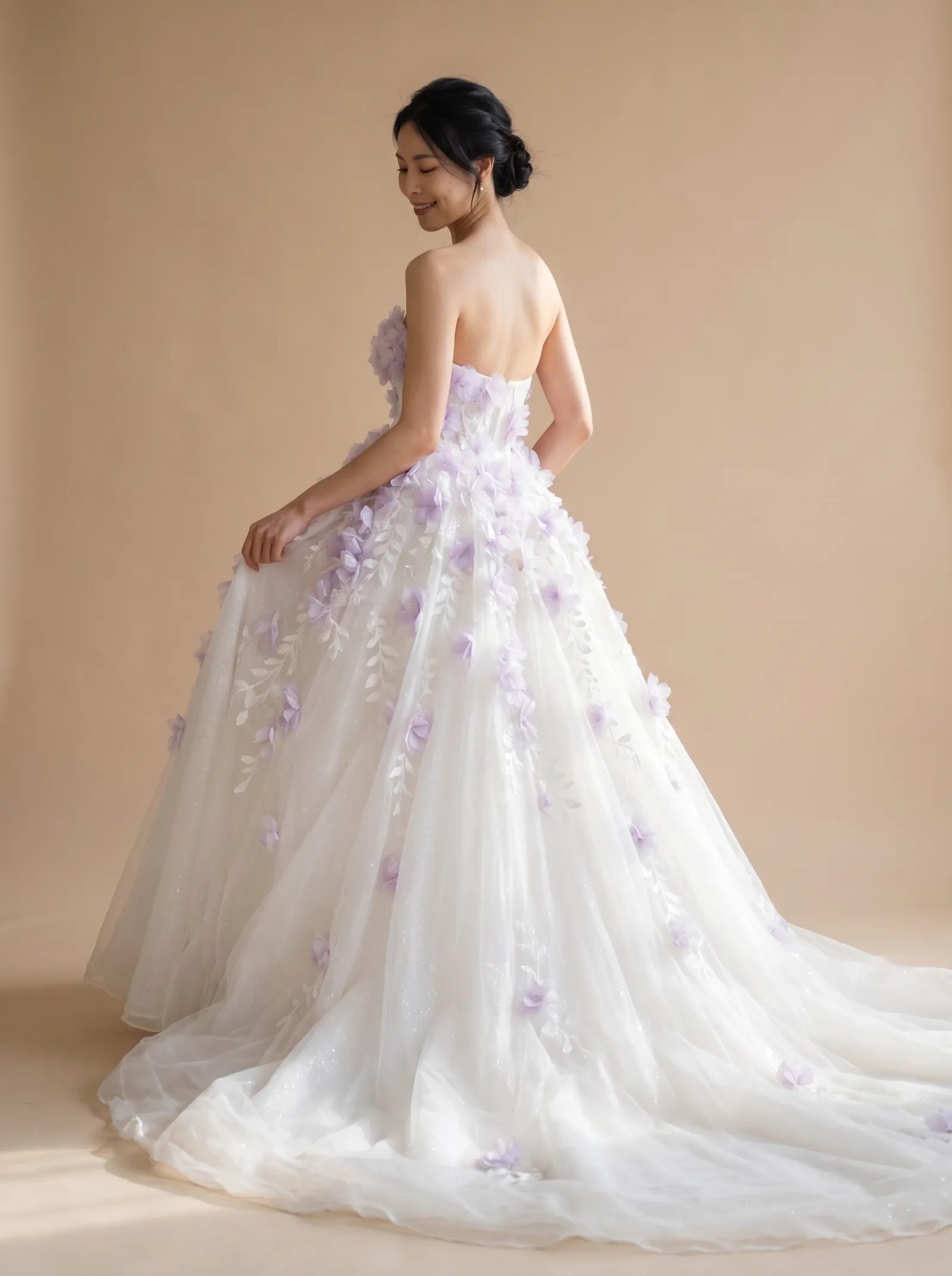 Violetta wedding gown, back - over-shoulder gaze lowered