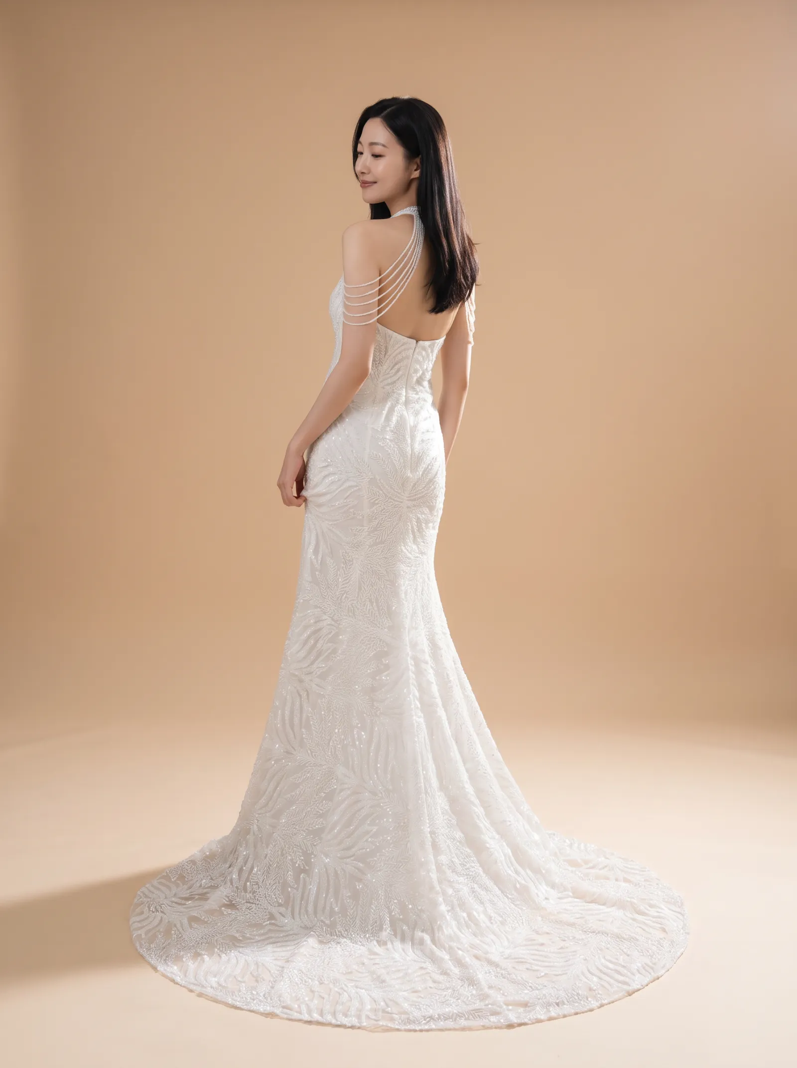 Mira wedding gown, back full-length, over-shoulder glance