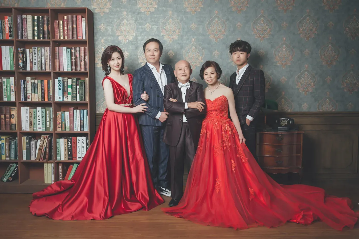 Formal family portrait in gowns and suits - family photo studio Singapore