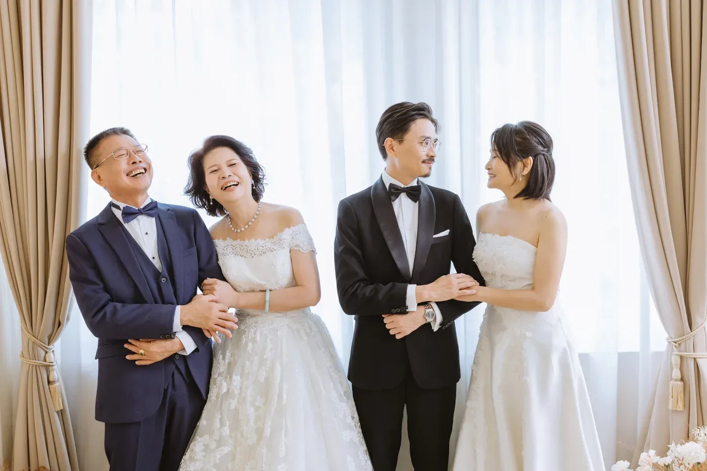 Formal family portrait in gowns and suits - family photo studio Singapore