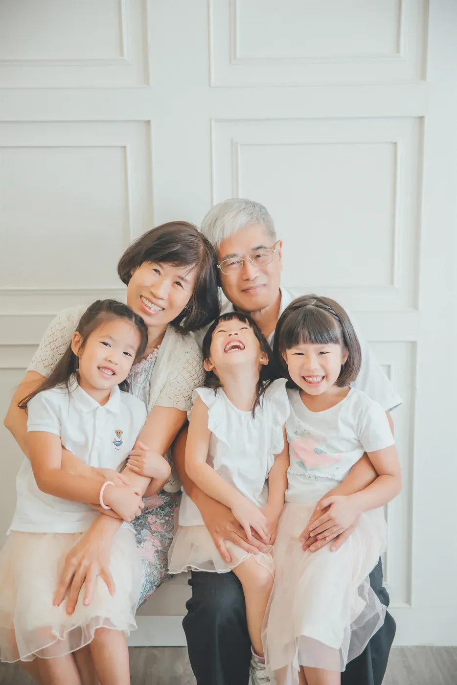 Three generation family photoshoot Singapore - grandparents, parents and children photographed together
