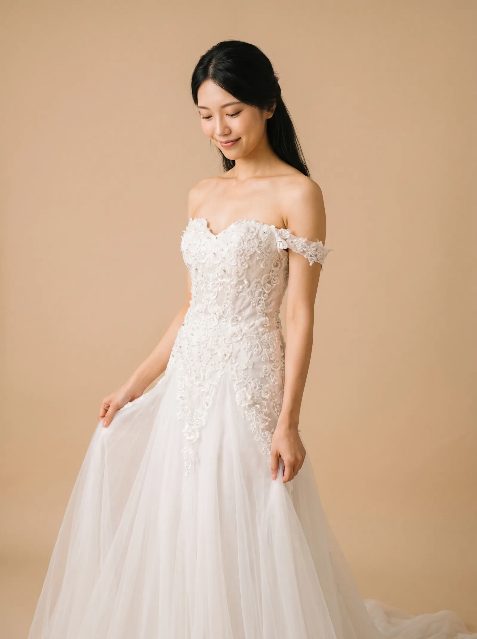 Arabella wedding gown, close view of the sweetheart neckline, off-shoulder lace straps and beaded floral bodice