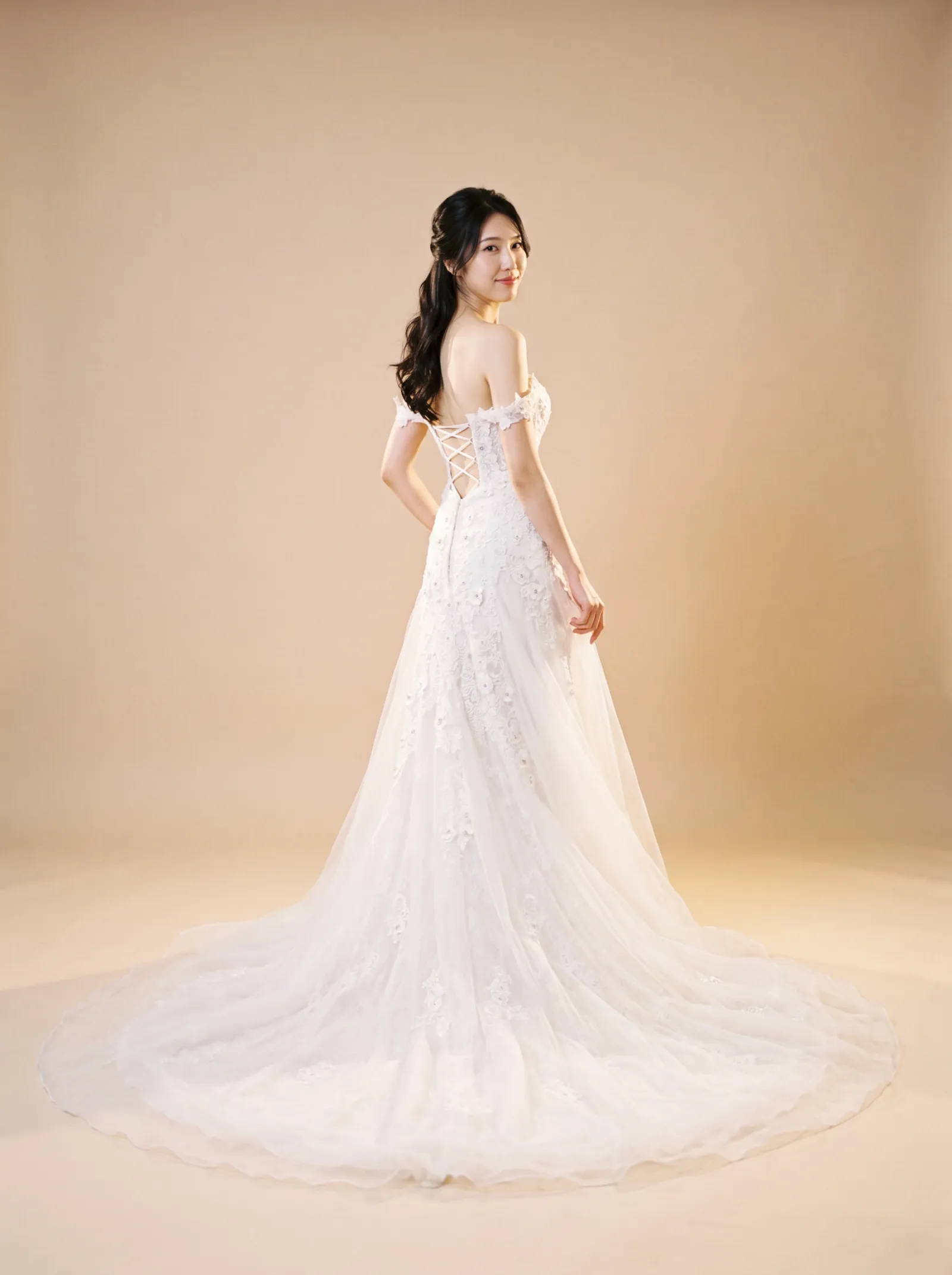 Arabella — Standard Catalog · Back full-length, over-shoulder glance