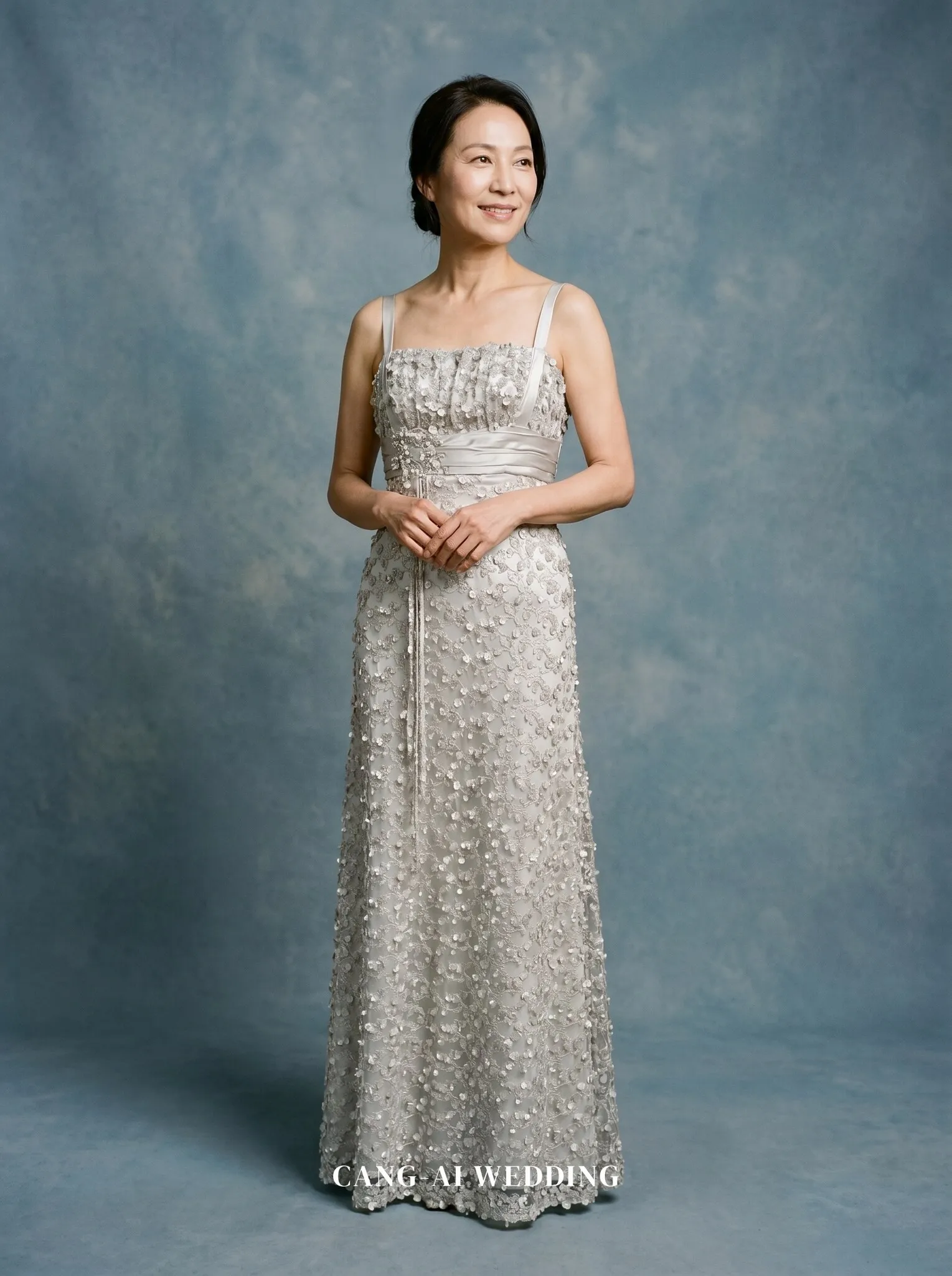 mother_gown_82 - Gently clasping hands at the waist