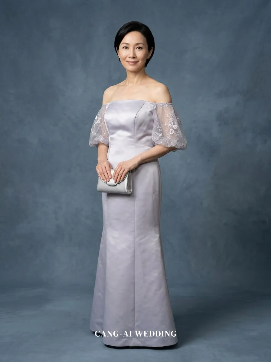 mother_gown_67 - Holding a classic satin clutch