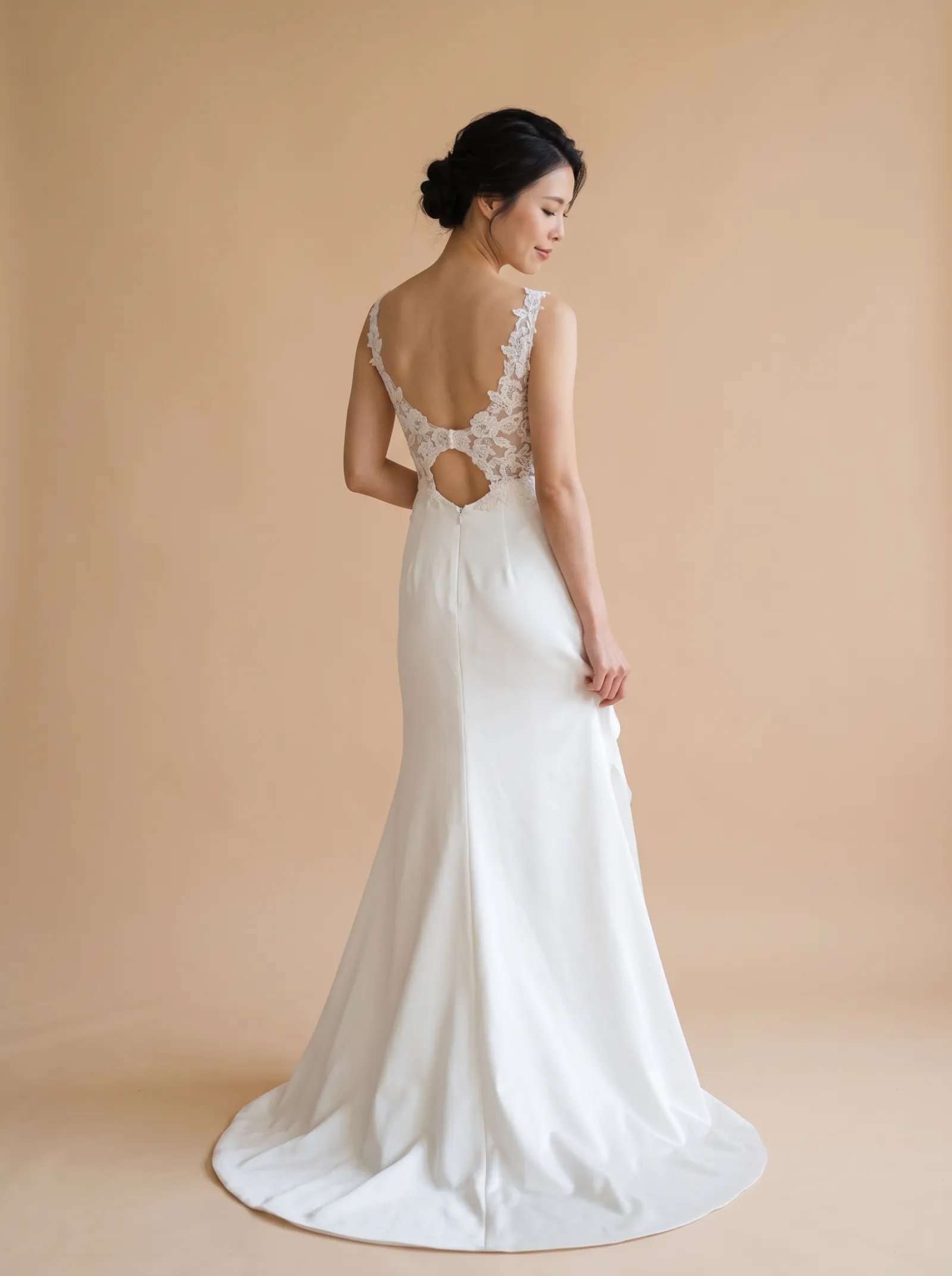 Nocturne wedding gown, back - over-shoulder gaze lowered