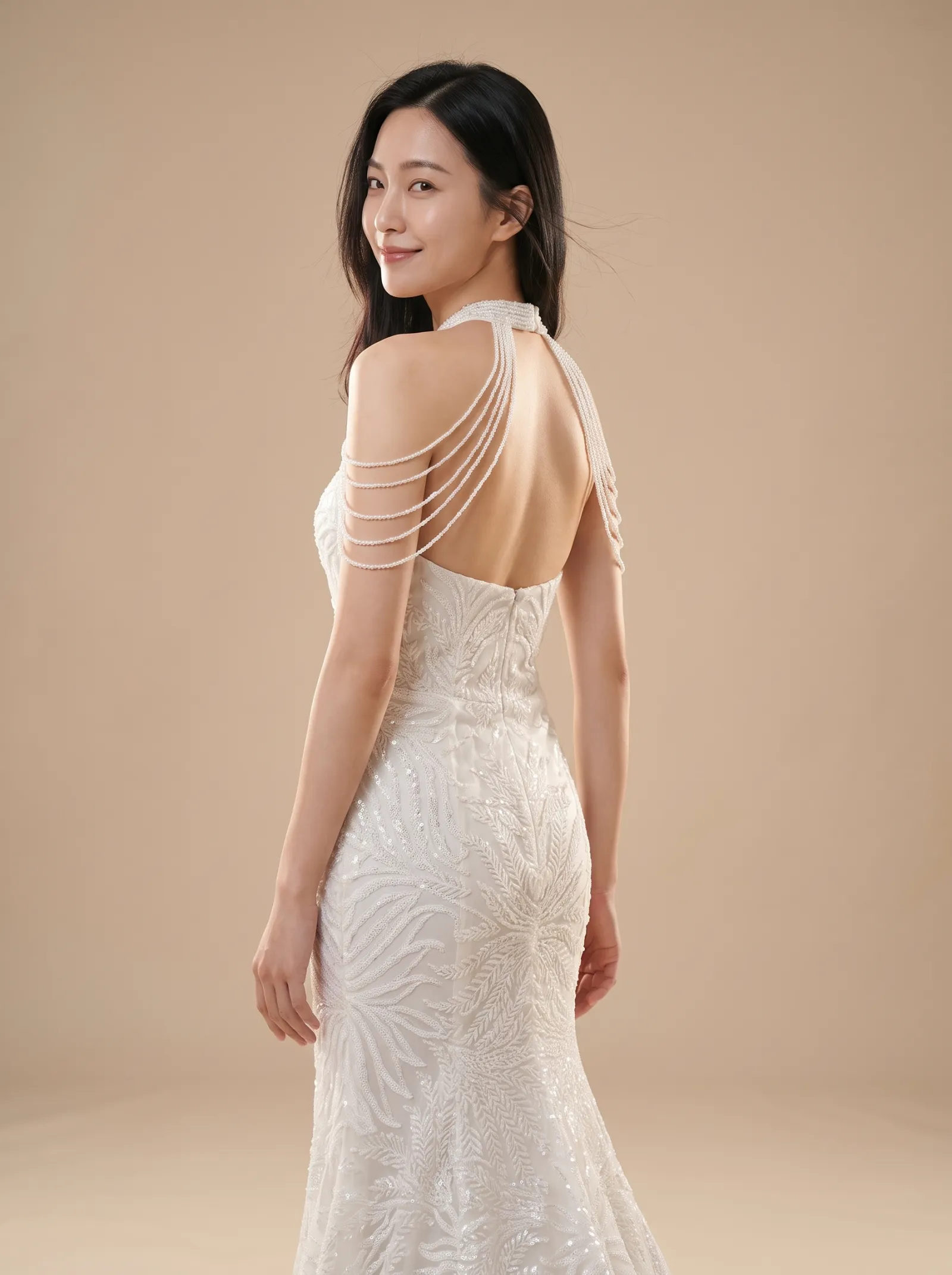 Mira wedding gown, three-quarter close - back, glancing over the shoulder
